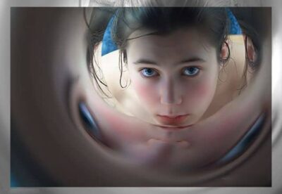 Face seen through a circular portal, representing 11:11 synchronicity and entry into the greater reality