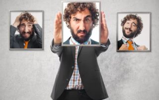 A man frames his face in different confused expressions, symbolizing emotional turbulence on the path toward mindfulness and healing.