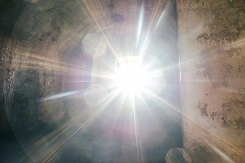 Bright light streaming through a doorway, symbolizing memory, reflection, and the enduring impact of love