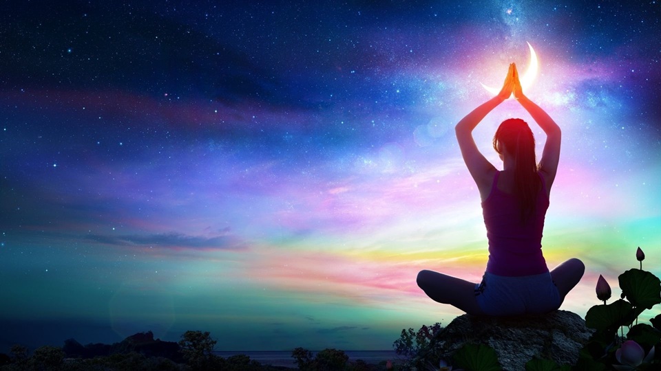 Woman meditating under a starry cosmic sky representing inner peace and intuitive guidance – Psychic Reading Categories at Whispy.