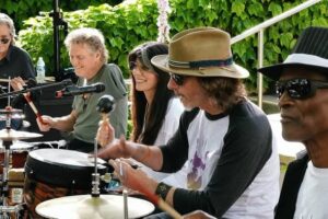 Rick Allen and Lauren Monroe lead a Raven Drum Foundation healing drum circle for veterans and first responders