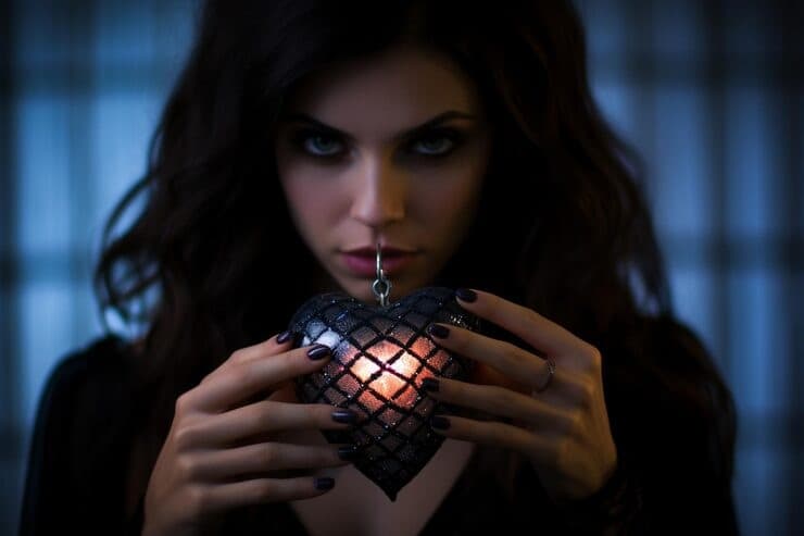 Psychic vampire symbolized by a woman draining emotional and energetic life force